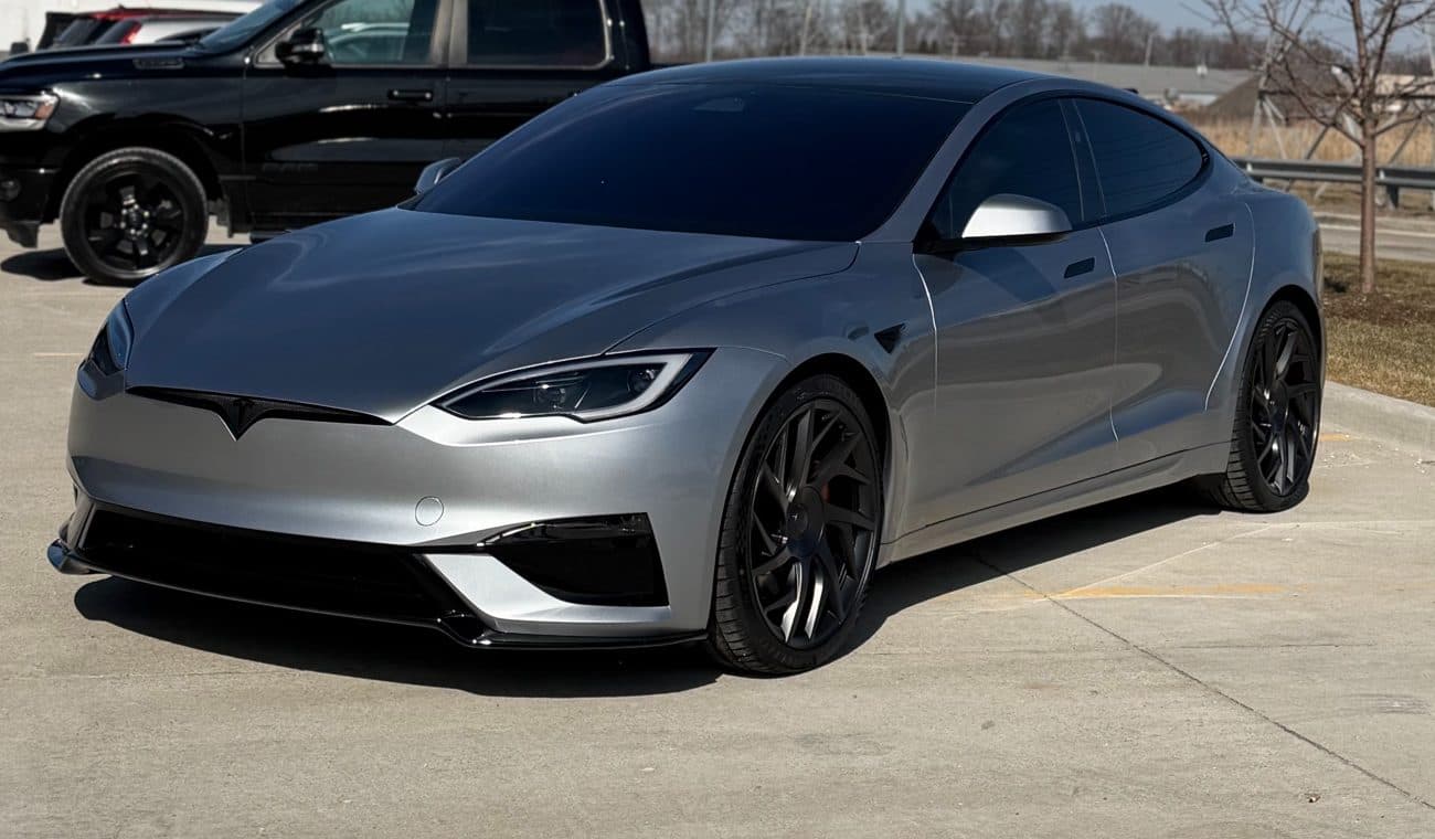 Customer's silver Tesla Model S Plaid outside the Diamond Detailz shop, with the panels the selected PPF package covers outlined